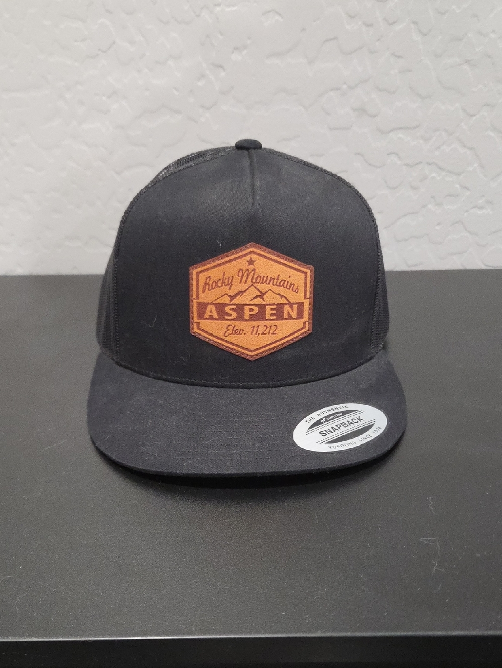 Aspen Rocky Mountains Black Trucker Hat with Tan Patch
